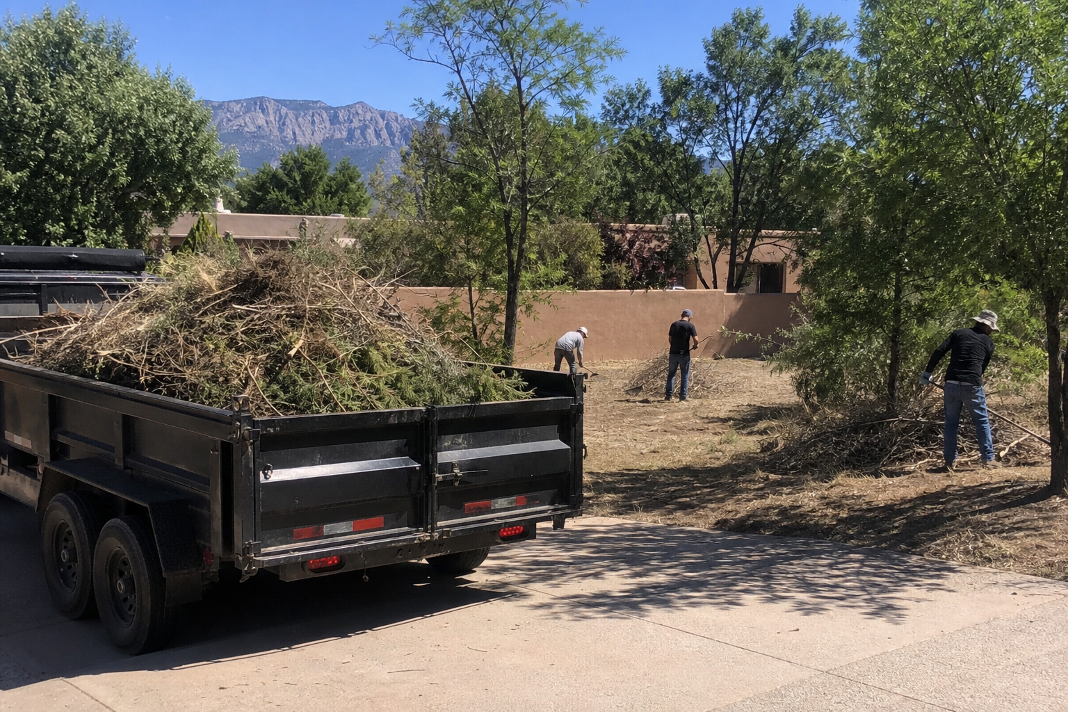 Bobcat loading debris during property cleanup